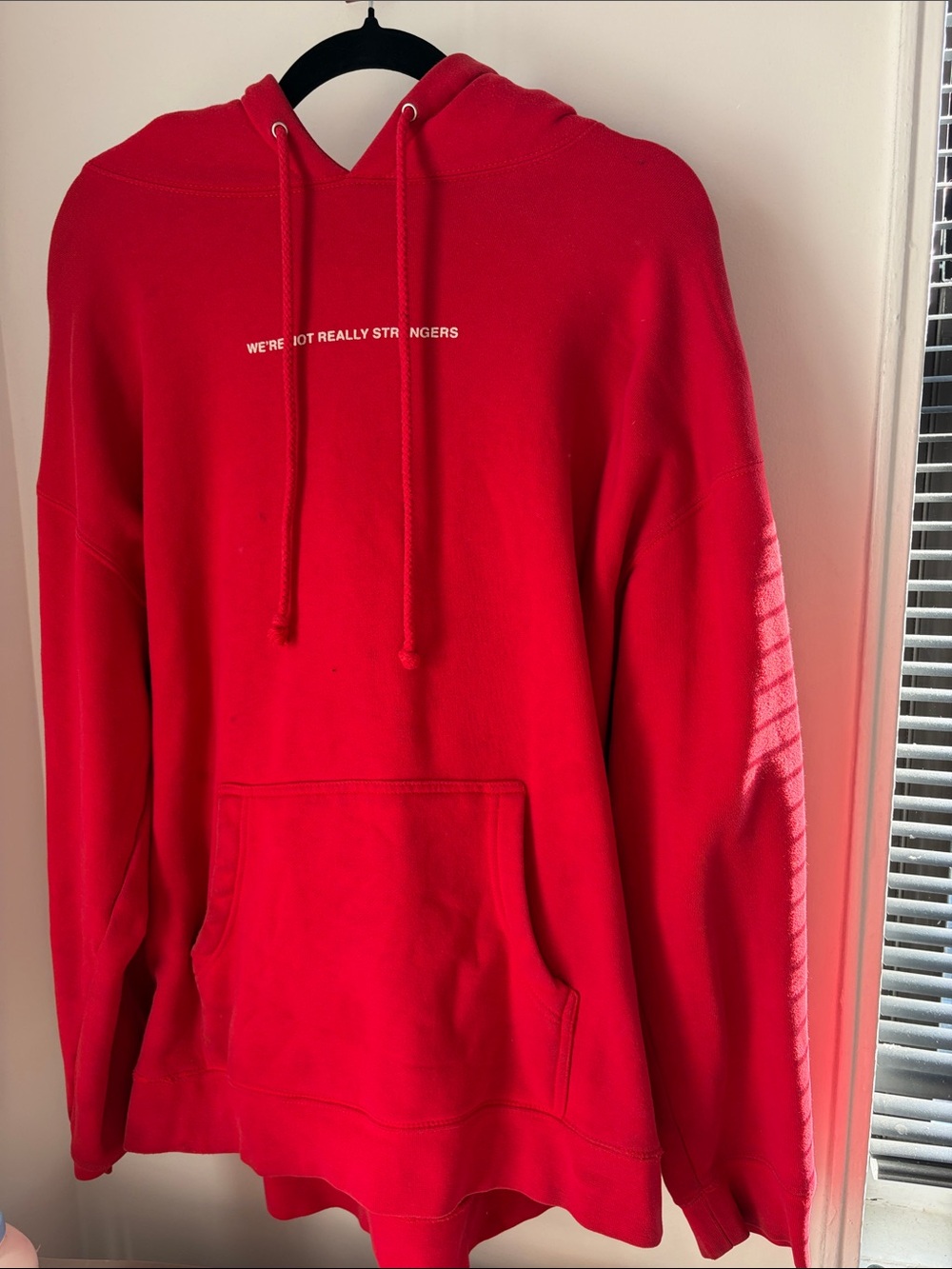 Men's Red Pullover Hoodie with Minimal Chest Text